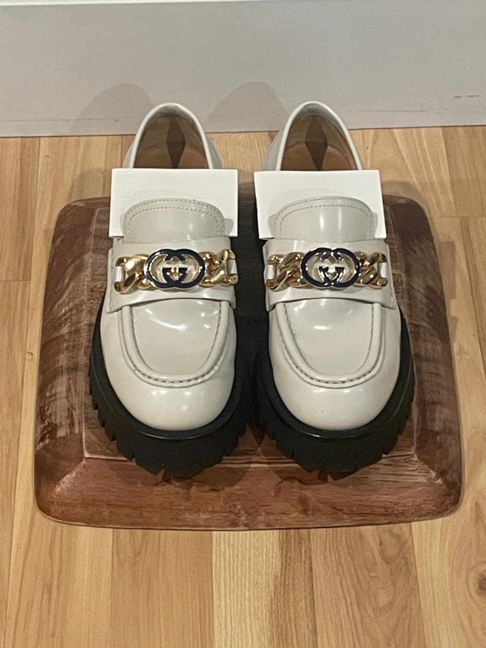 Gucci Cordovan Lux in Mysric White. Lug Sole Loafers. Navy Logo w/ Gold Chain.